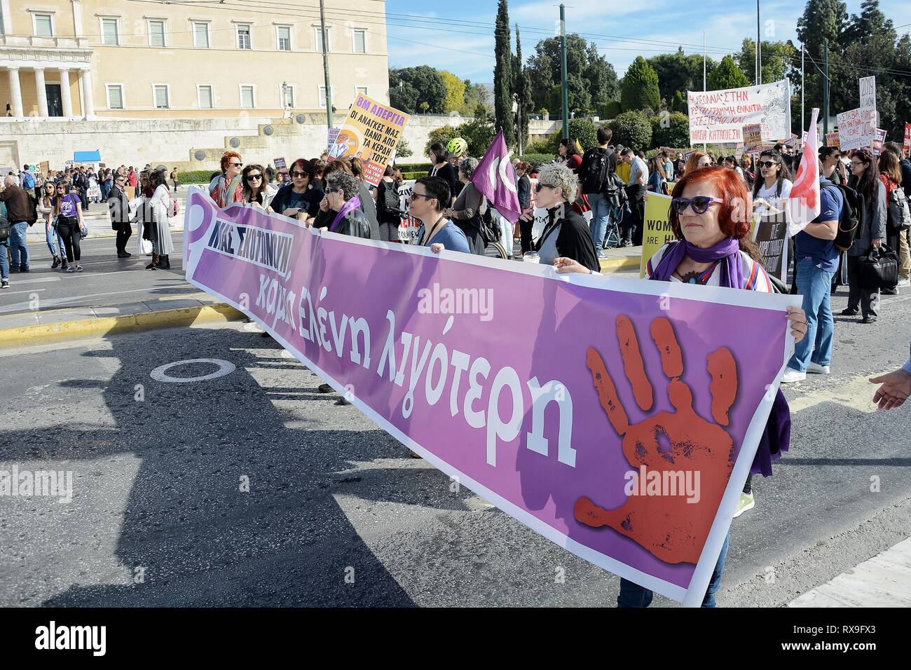 Women seen holding a banner during the march. Women's rights movements